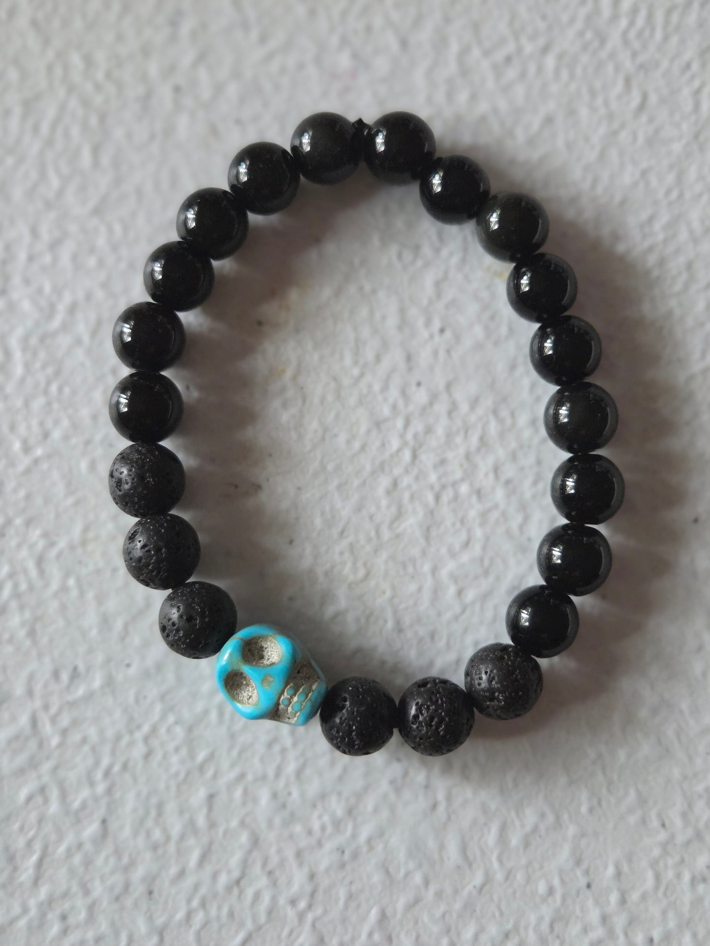 Obsidian and Lava stone with Blue skull