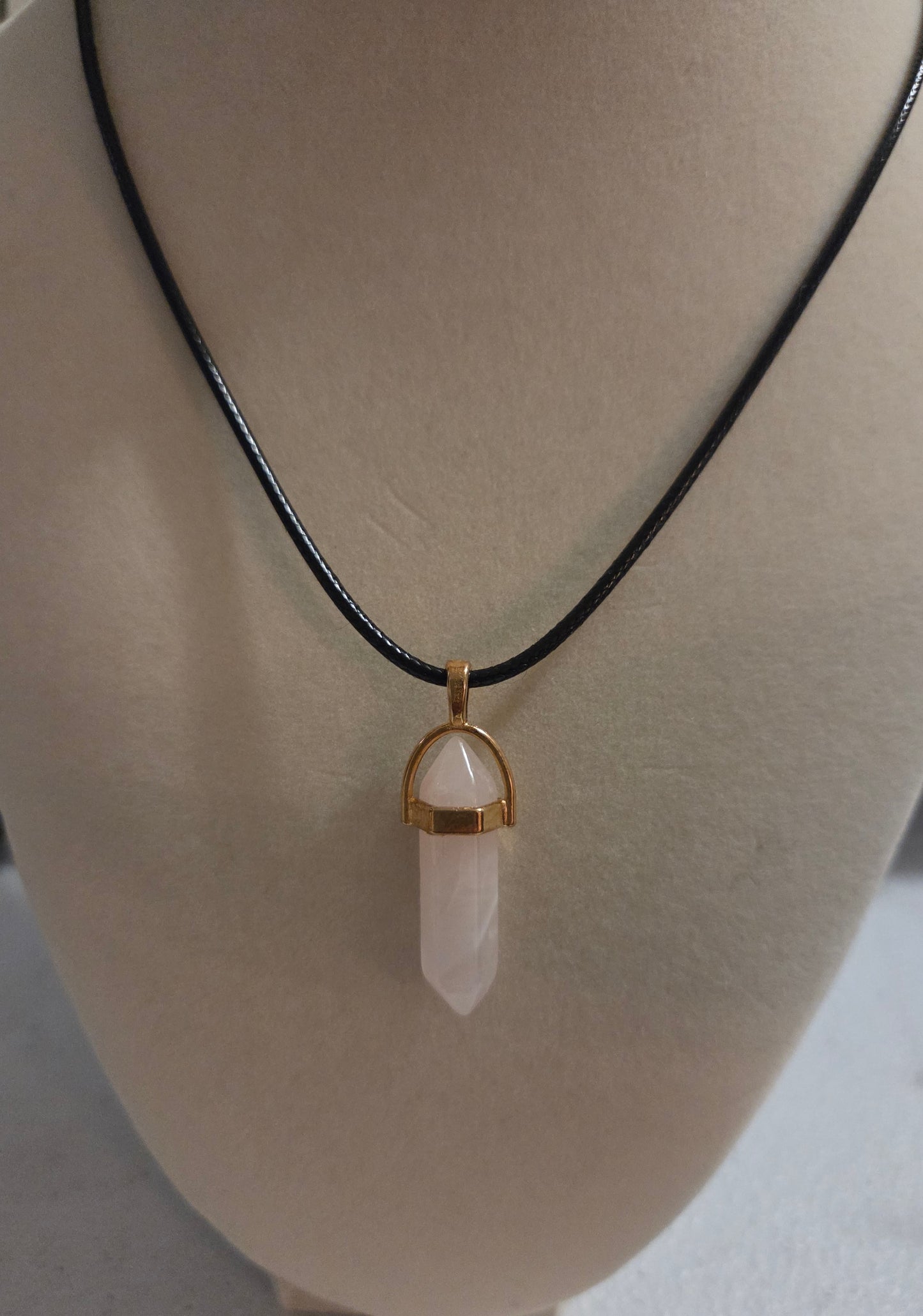 Rose quartz pendant with cord
