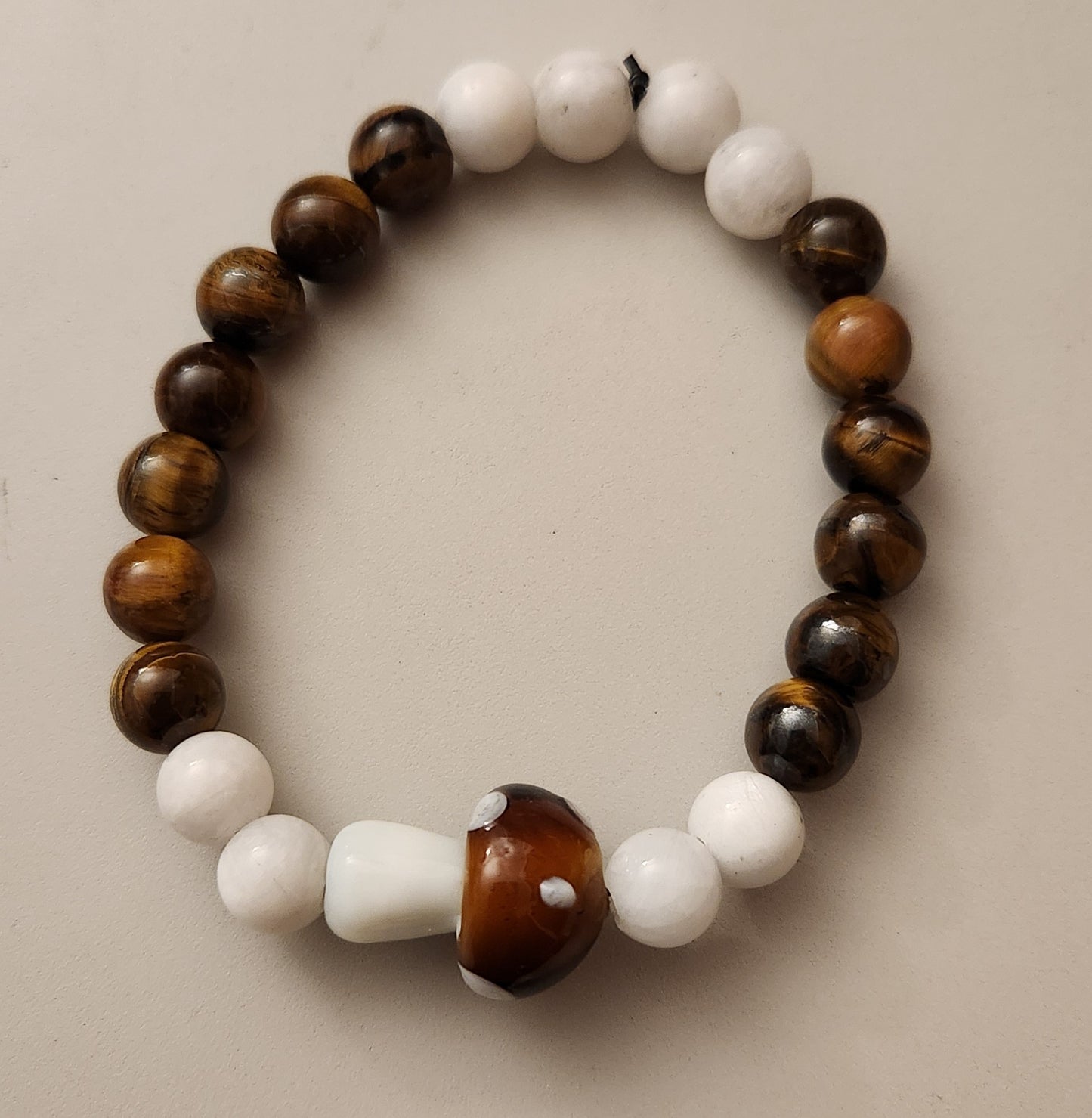 Tigers eye and Moonstone with a mushroom