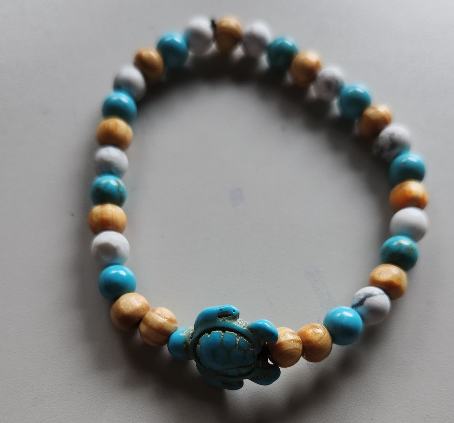 Turquoise and Howlite with Sea turtle charm and wood bead accents