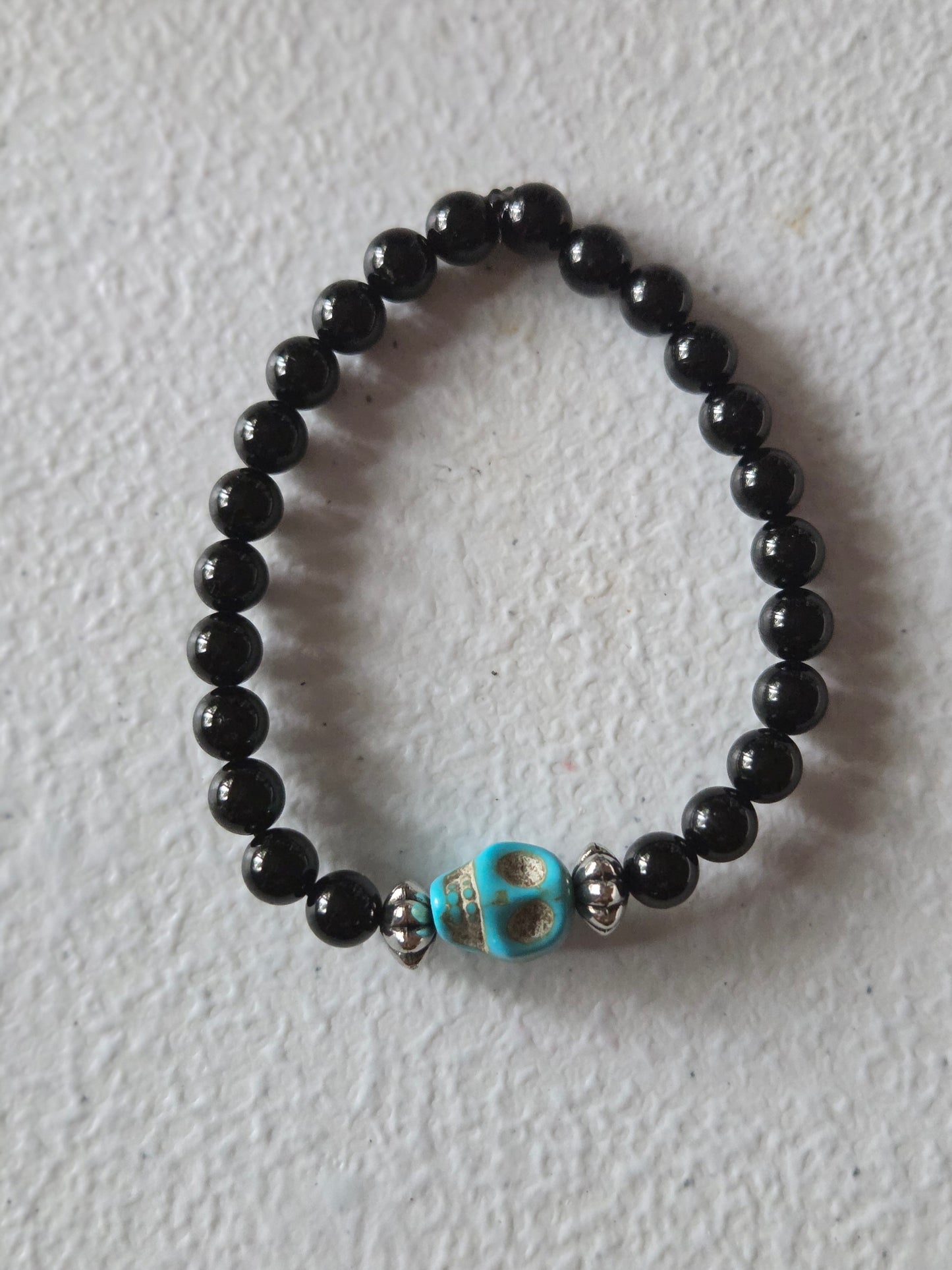 Obsidian with Blue skull charm and silver bead accents