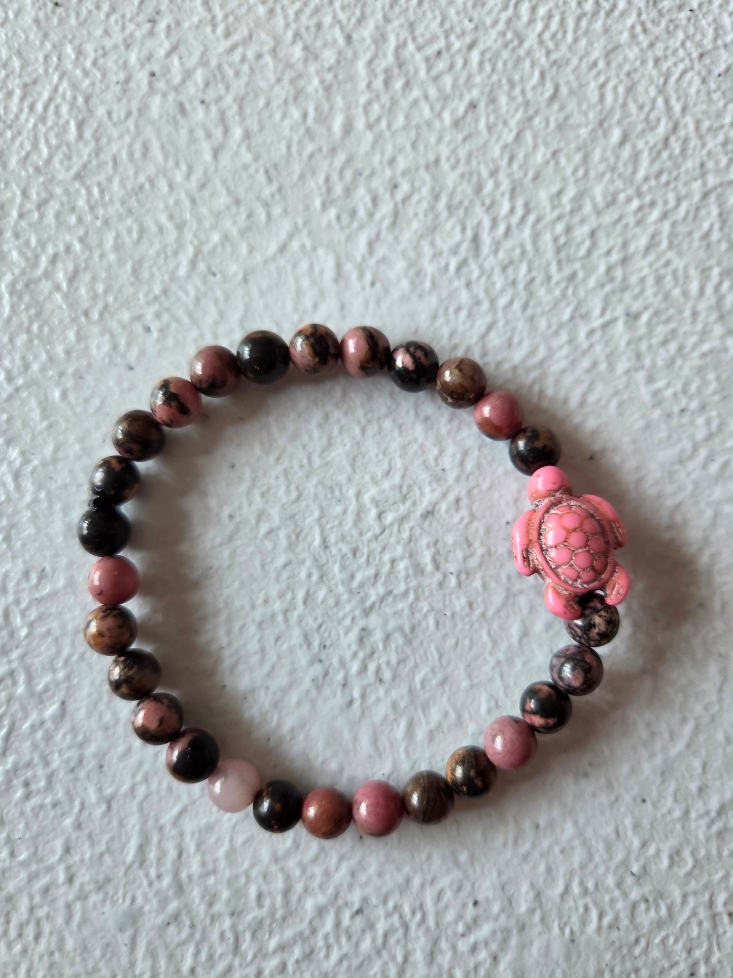 Haitian Flower Rhodonite with pink sea turtle