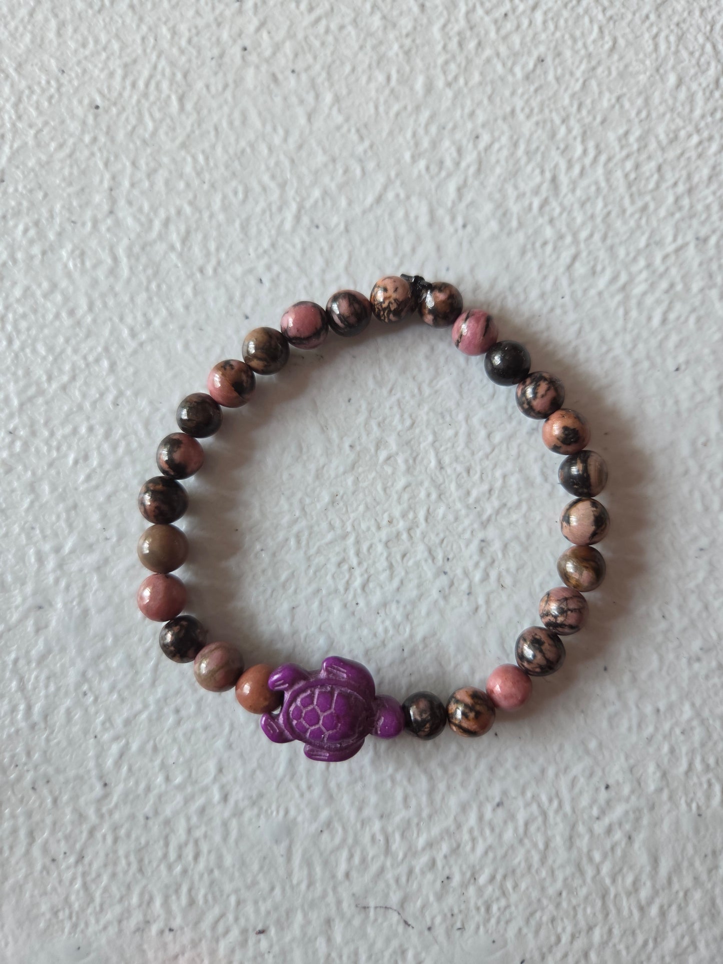 Haitian Flower Rhodonite with purple sea turtle