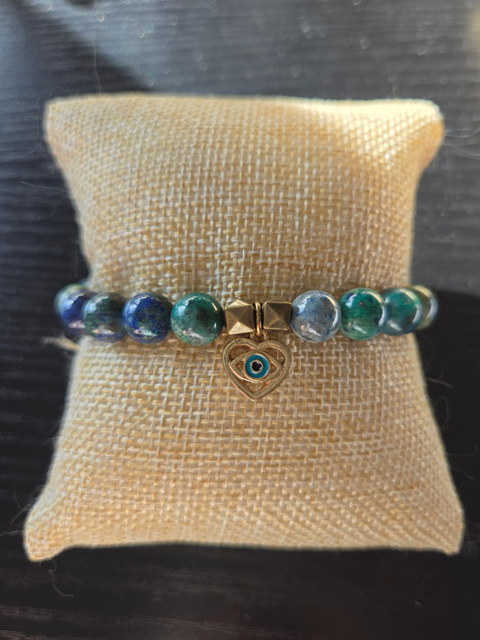 Chrysocolla and Azurite in Lapis with evil eye charm