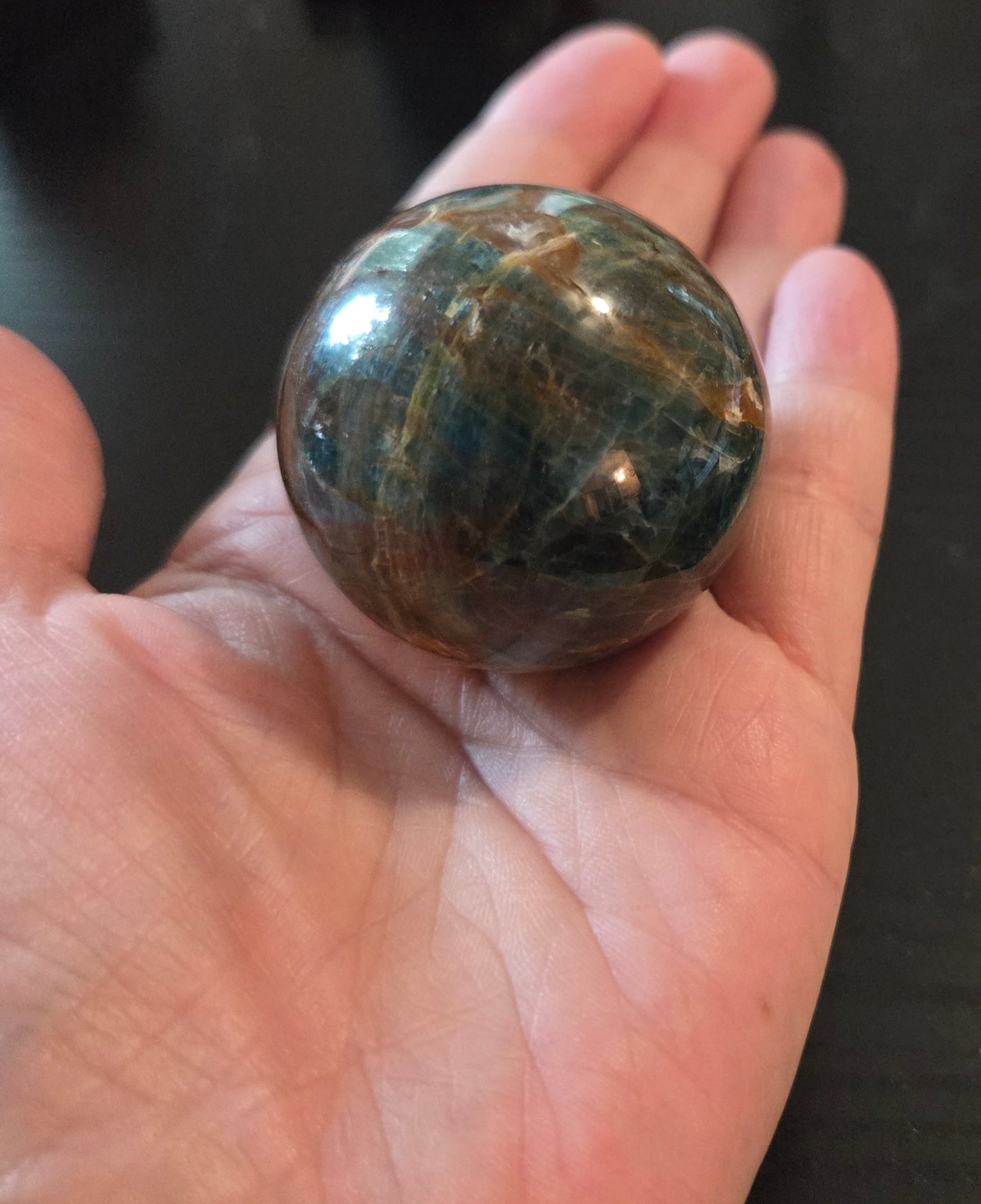 Small Blue Apatite sphere with Rosewood stand